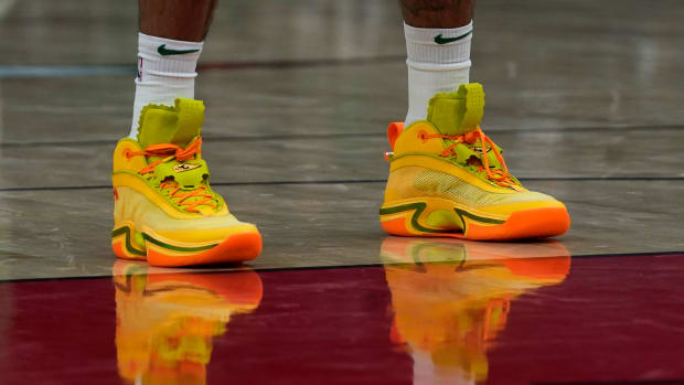 Green, yellow, and orange Air Jordan shoes.